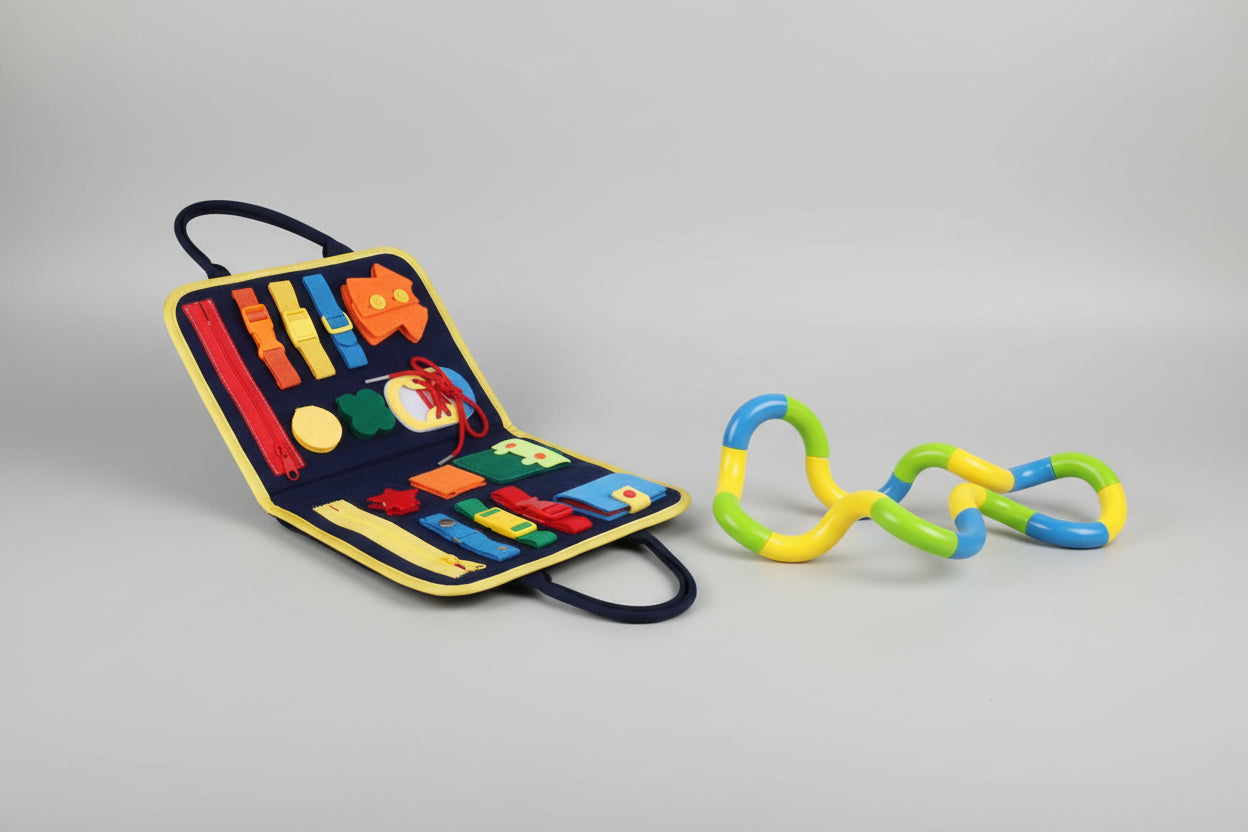 Set of educational toys including a colorful tool kit and interlocking rings on a white background.