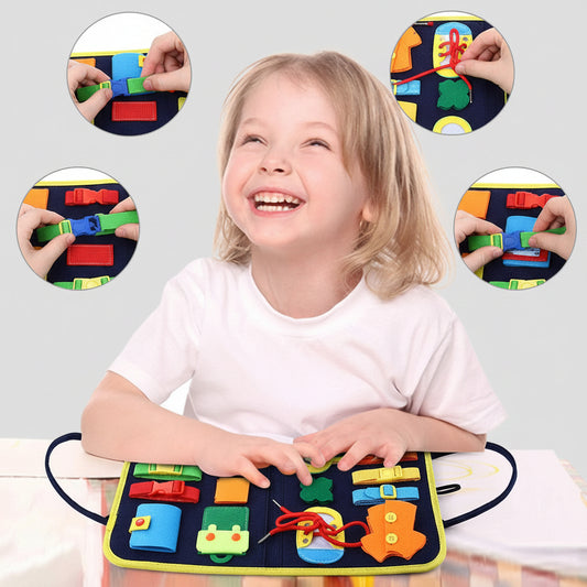Child playing with a colorful educational toy mat with various shapes and patterns.