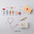 Measurement chart of a toy medical set with various medical tools and a wooden box labeled 'First Aid'.